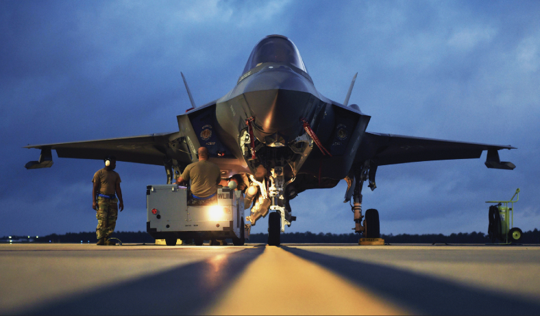 Air Force weapons load crew members assigned to 58th Aircraft Maintenance Unit load AIM-120 advanced medium-range air-to-air missile toF-35 Lightning II during exercise Combat Archer at Eglin Air Force Base, Florida, June 10, 2020 (U.S. Air Force/Heather Leveille)